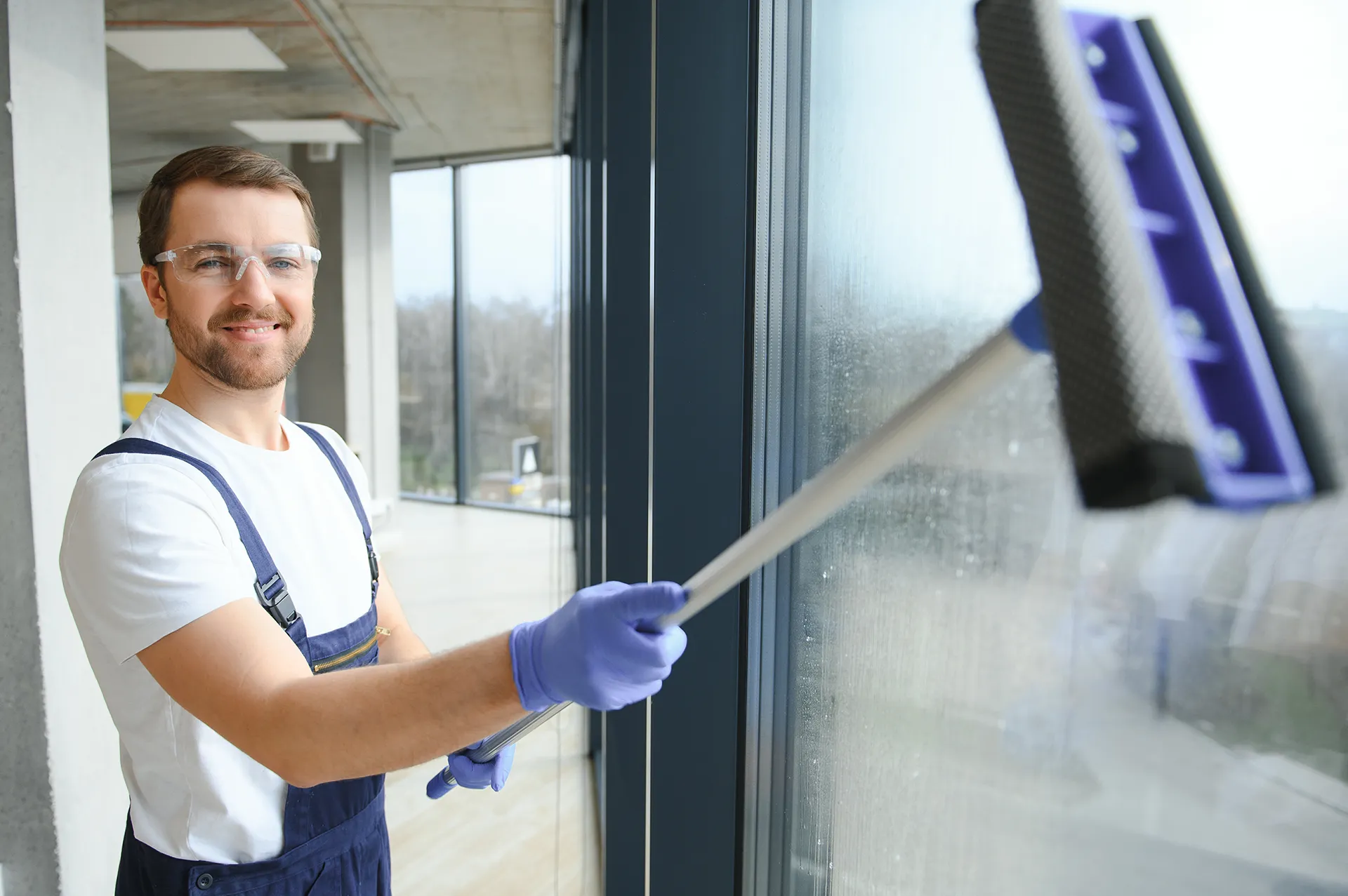 Domestic cleaner in Melbourne efficiently cleaning a window